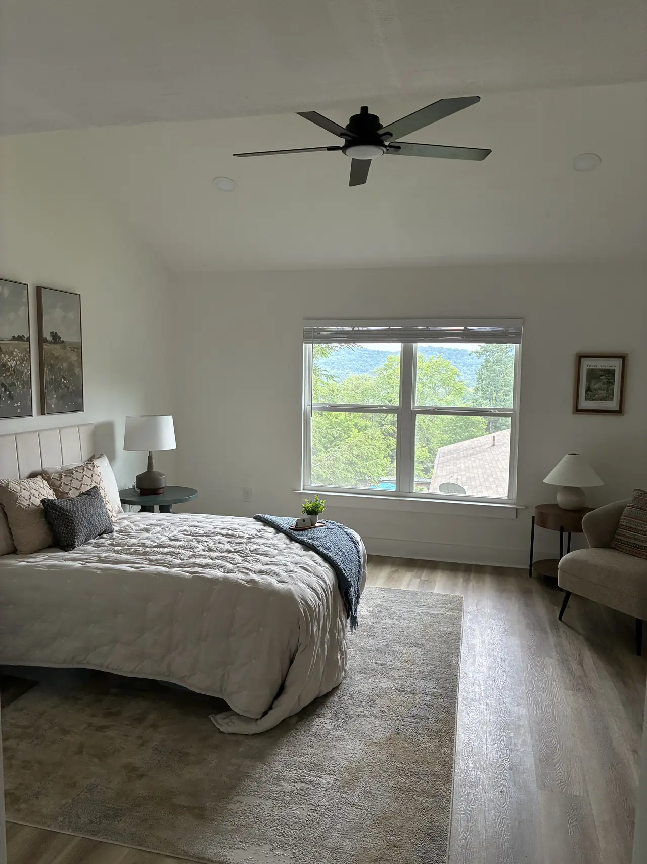 Bedroom with a black ceiling fan, recessed lights, a double window, and wood-look plank flooring